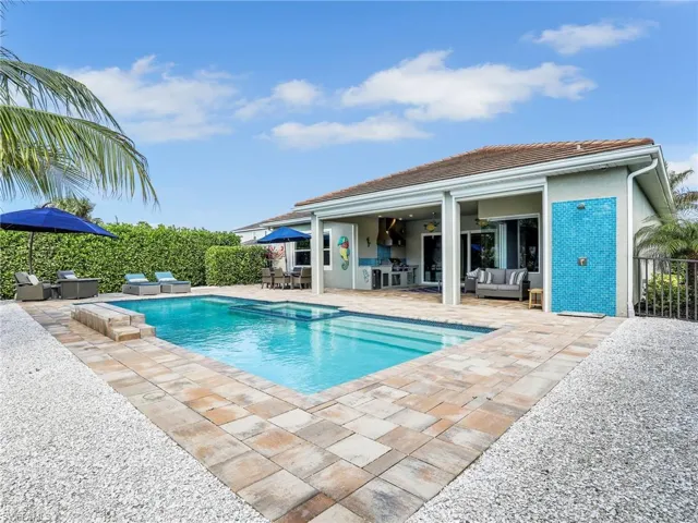 View of swimming pool featuring outdoor lounge area and a patio