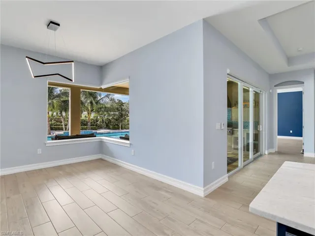 Empty room with light hardwood / wood-style floors