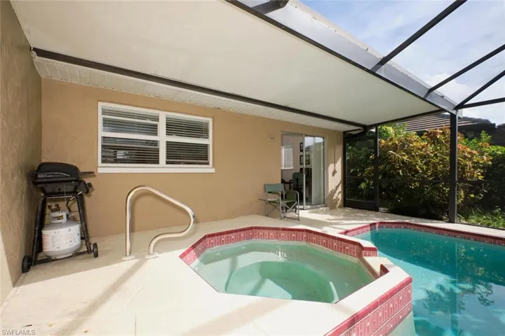 View of pool with a patio, in ground hot tub