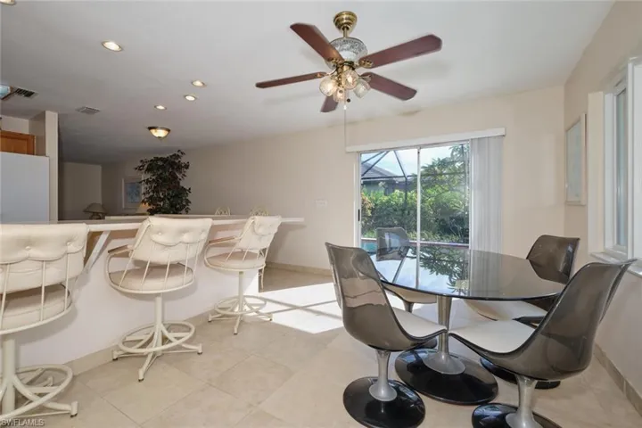 House - Tiled dining room featuring ceiling fan