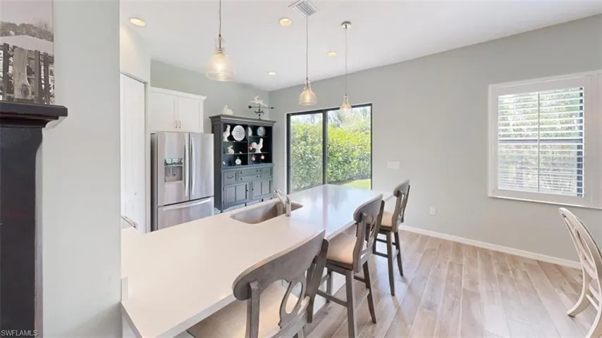 Dining area featuring light hardwood / wood-style floors and sink