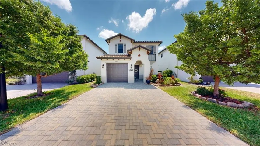 Mediterranean / spanish-style house featuring a garage