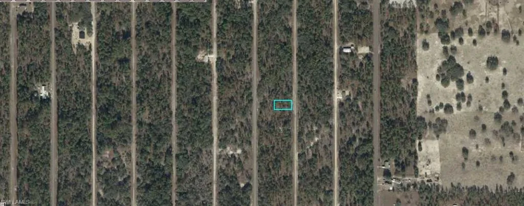 Aerial View. Illustrating the property's boundaries and surrounding terrain