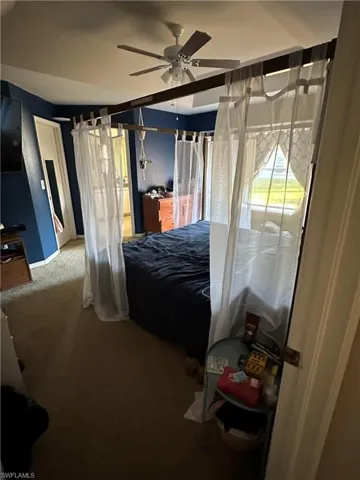 Bedroom featuring carpet floors and a ceiling fan