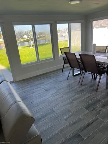 Sunroom / solarium with a water view