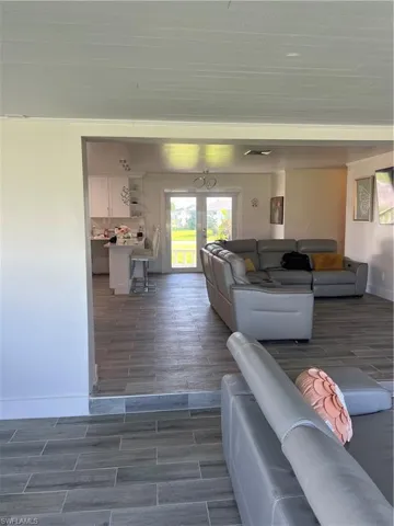 Living area featuring wood tiled floors and baseboards
