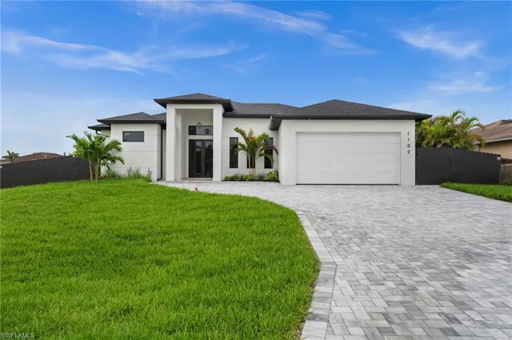Contemporary single-story residence with a white stucco exterior