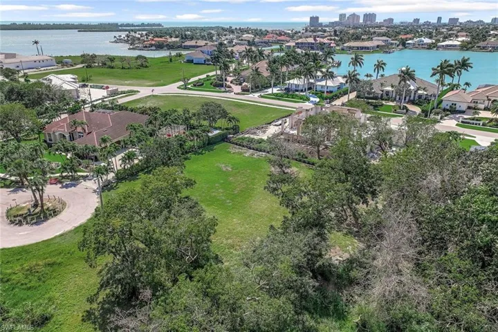 Aerial view of residential area featuring a large body of water