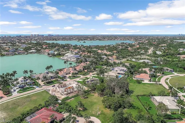 Aerial view of residential area with a large body of water