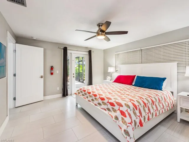 Bedroom featuring access to exterior and ceiling fan