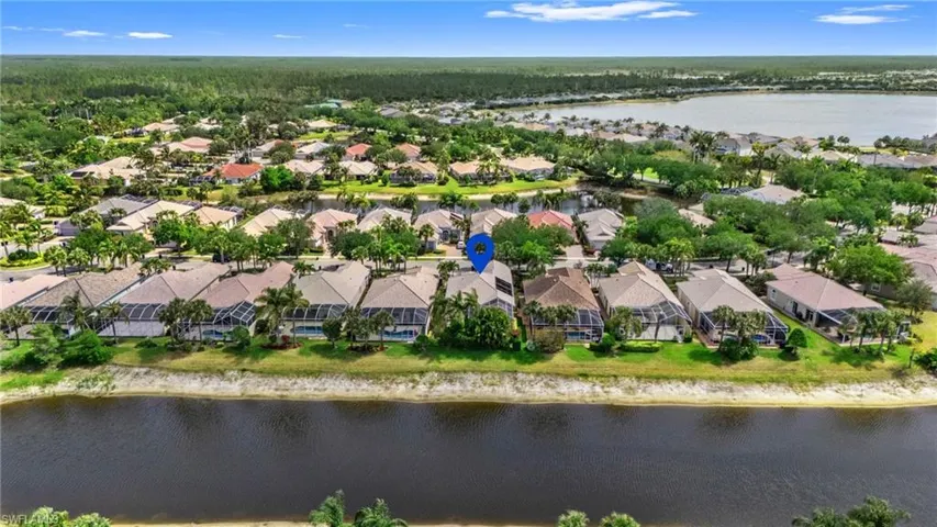 Drone / aerial view with a residential view and water view.