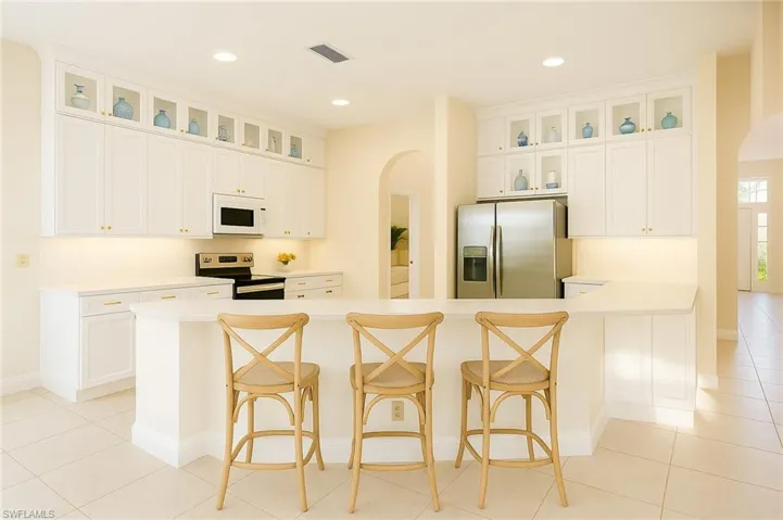 painted white and add a tier of upper cabinets and this will be your new kitchen