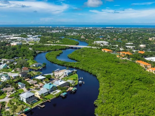 Aerial overview of property's location featuring a large body of water