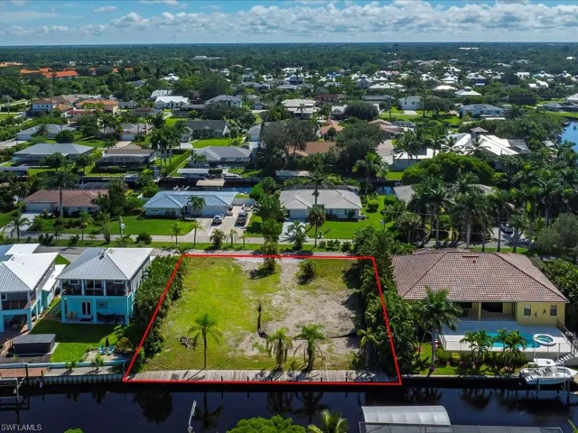 Aerial view of residential area with property boundaries highlighted