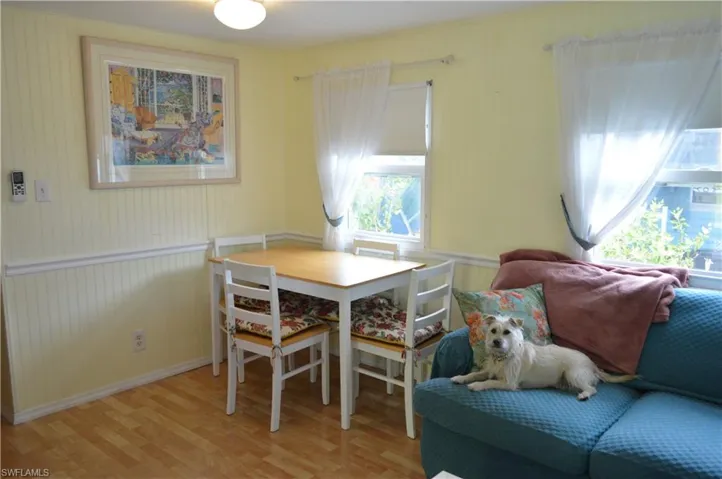 Dining  with light wood finished floors and baseboards