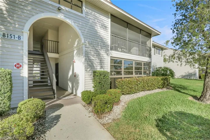 Doorway to property featuring a yard