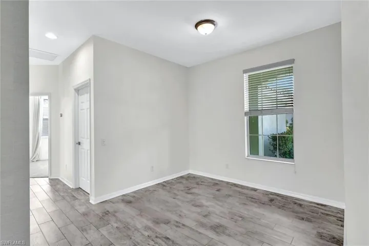 Unfurnished room with light hardwood / wood-style floors