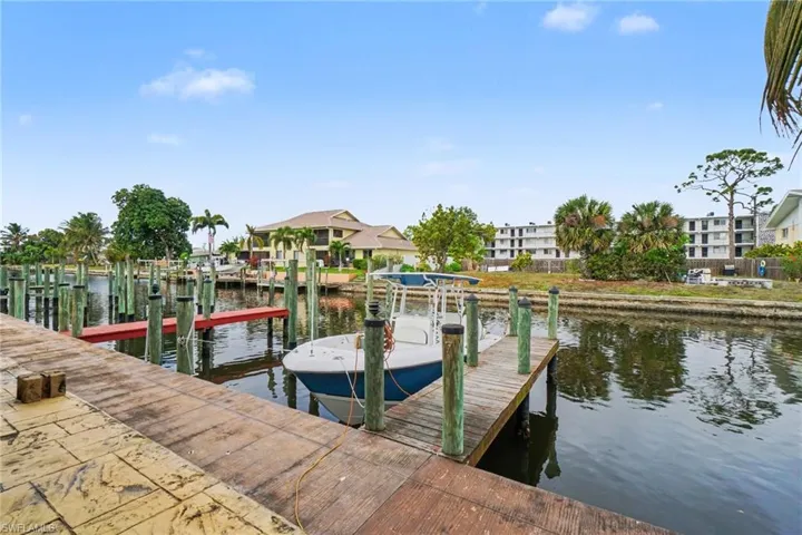 Dock area featuring a water view and boat lift