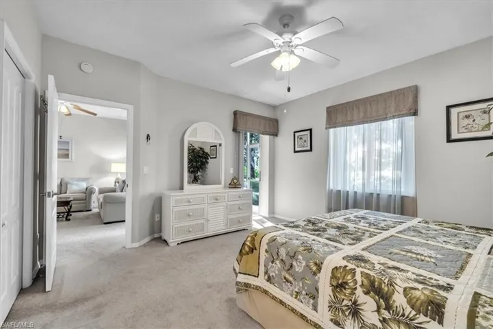 Bedroom with carpet and a ceiling fan