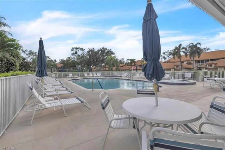 Community pool featuring a patio
