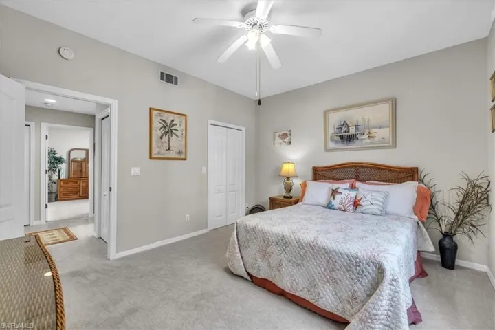 Bedroom featuring carpet floors, a closet, and ceiling fan