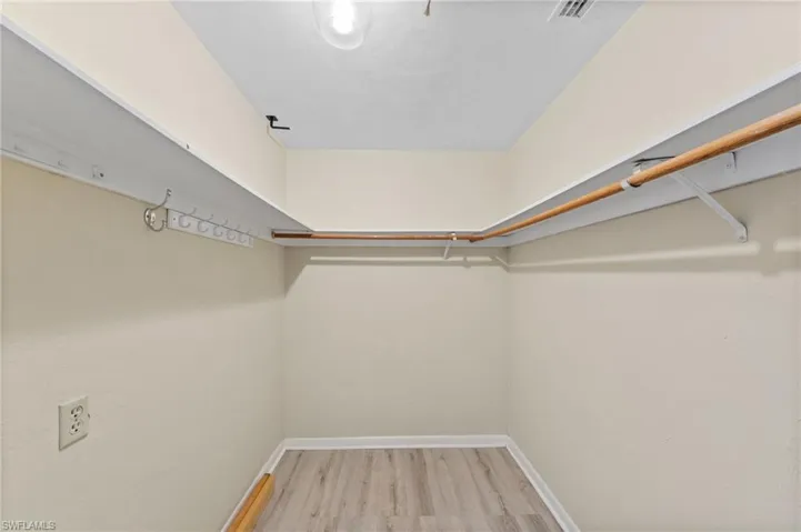 Walk in closet featuring light wood-type flooring
