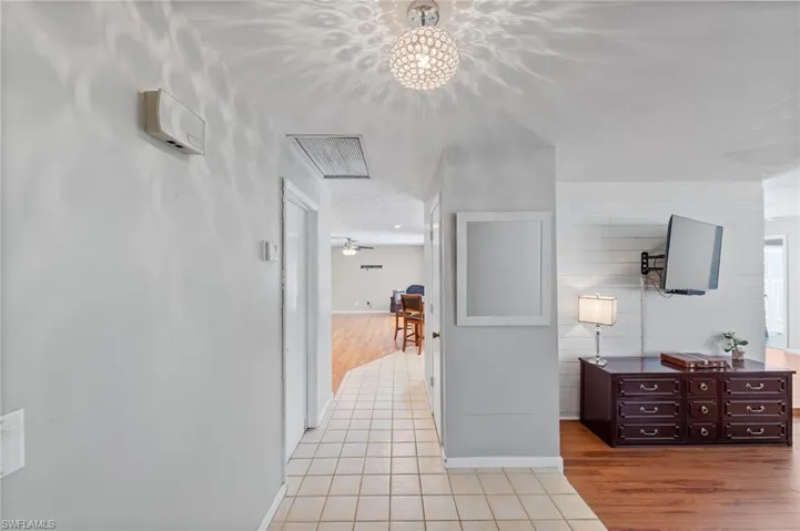 Hallway with light wood-type flooring