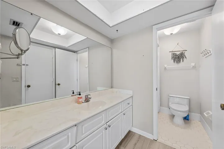 Bathroom featuring vanity and light wood finished floors