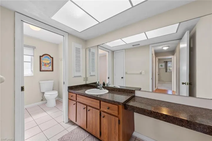 Bathroom featuring vanity and light tile patterned flooring
