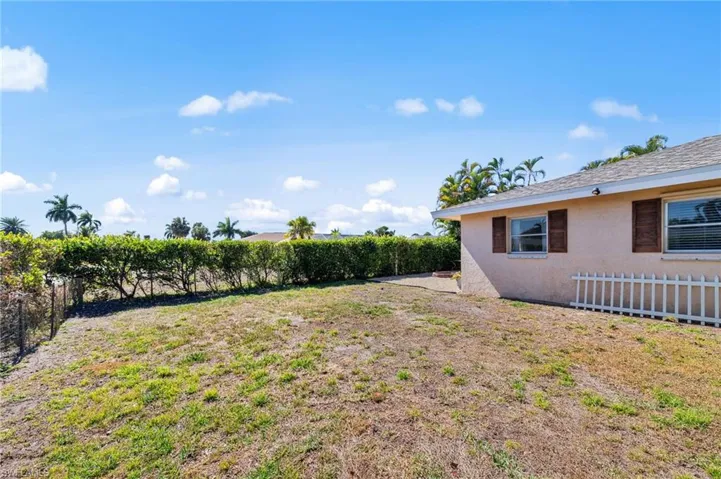 View of fenced backyard