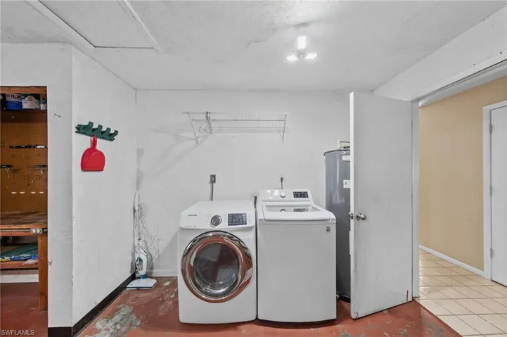 Laundry area with independent washer and dryer and water heater