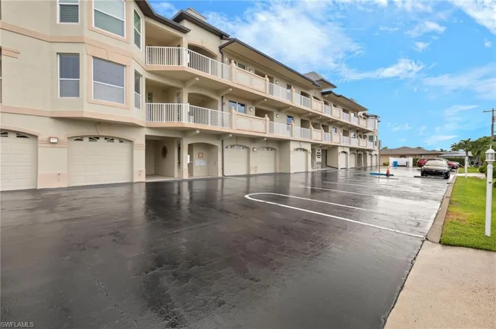 View of property featuring a garage