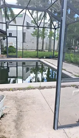 View of pool with a lanai