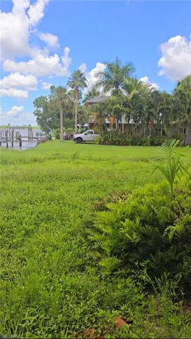 View of yard with a dock