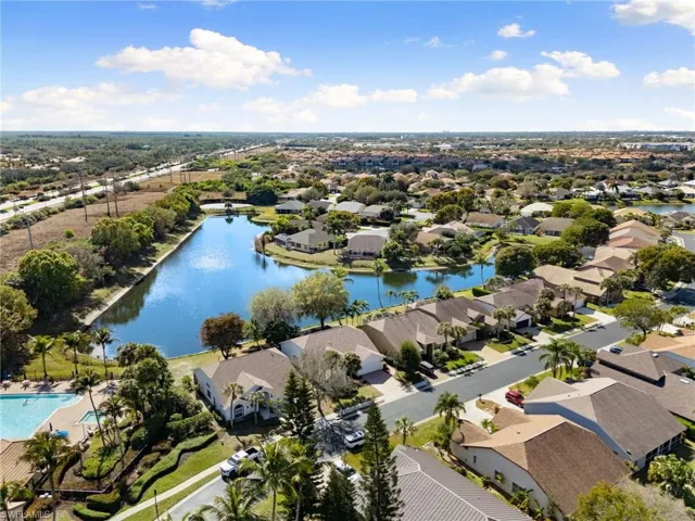 Aerial view of residential area featuring a large body of water