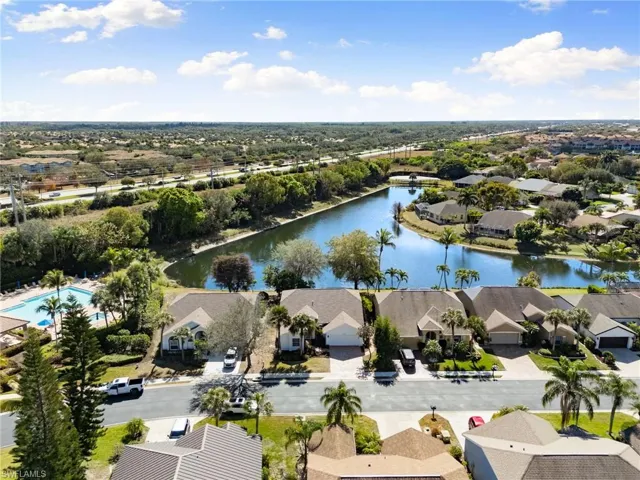 Aerial perspective of suburban area with a nearby body of water