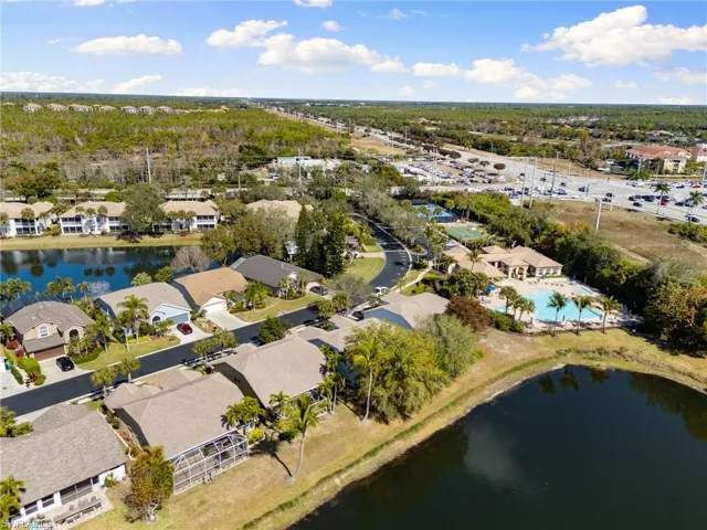 Aerial perspective of suburban area with a large body of water