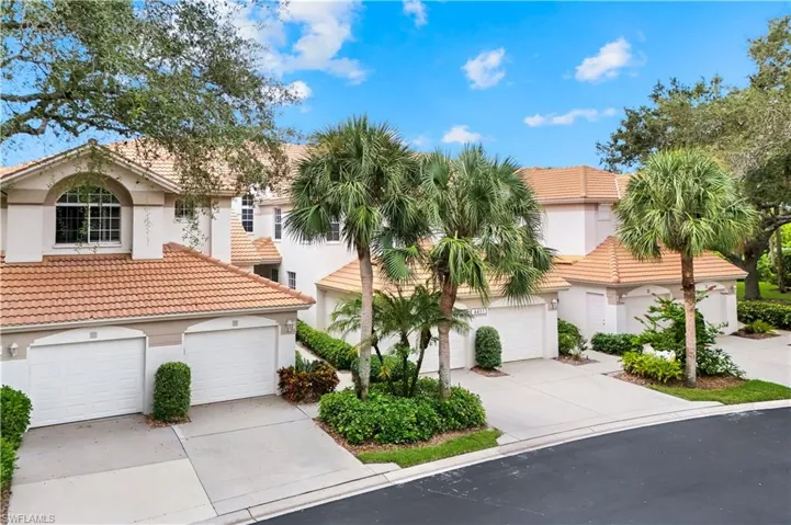 Mediterranean / spanish-style house featuring stucco siding, a tiled roof, and driveway