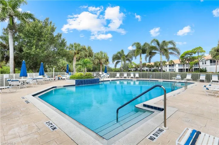 Community pool featuring a patio
