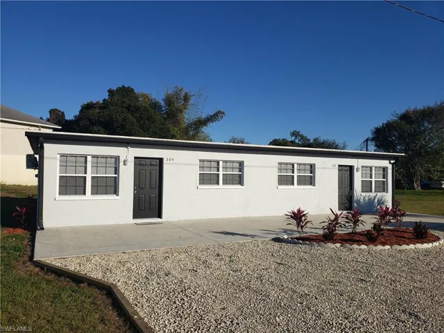 Single story home with stucco siding