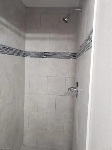 Bathroom view of a tile shower