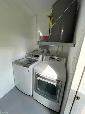 Laundry area featuring washer and clothes dryer