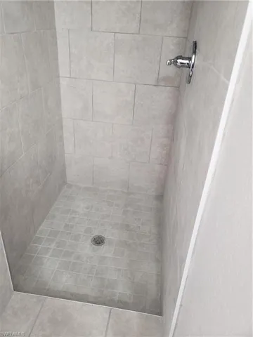 Bathroom view of a tile shower