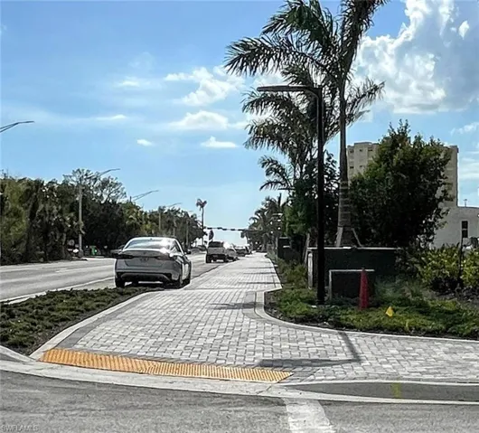 View  street featuring street and sidewalks, leading to Vanderbilt Beach