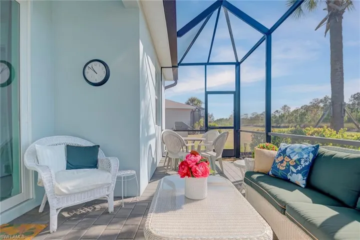 Sunroom / solarium with outdoor lounge area, outdoor dining space, tile patterned floors, and a wooden deck