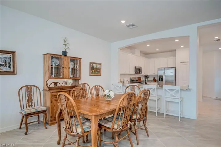 Dining space featuring recessed lighting and light tile patterned floors