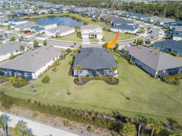 Aerial perspective of suburban area with a large body of water