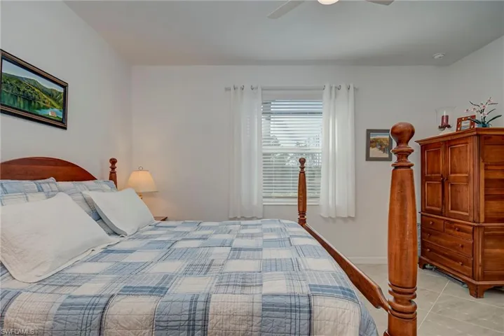 Bedroom featuring ceiling fan and light tile patterned floors