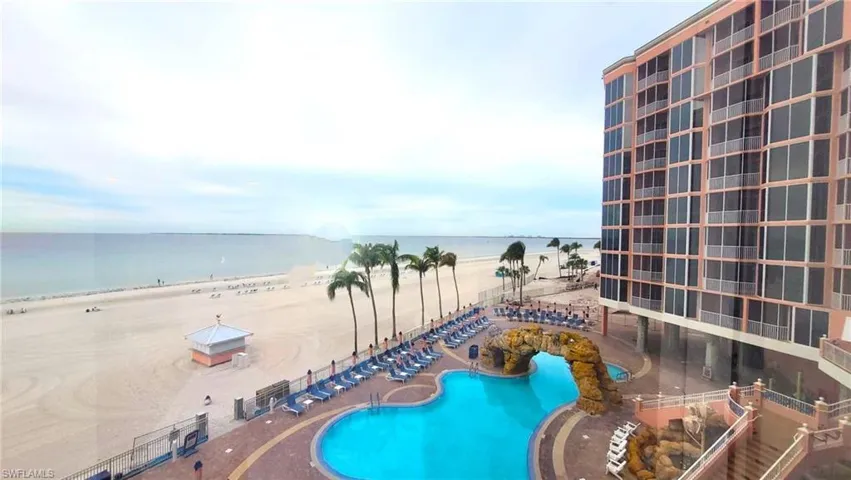 Community pool featuring a water view