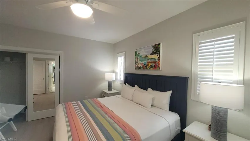 Bedroom with ceiling fan and carpet flooring